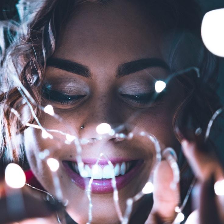 Kaveri Mehta, Lead Design Curator at AncientKernelGentle, reviewing corporate floral arrangements